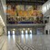 A room featuring murals and a tiled floor